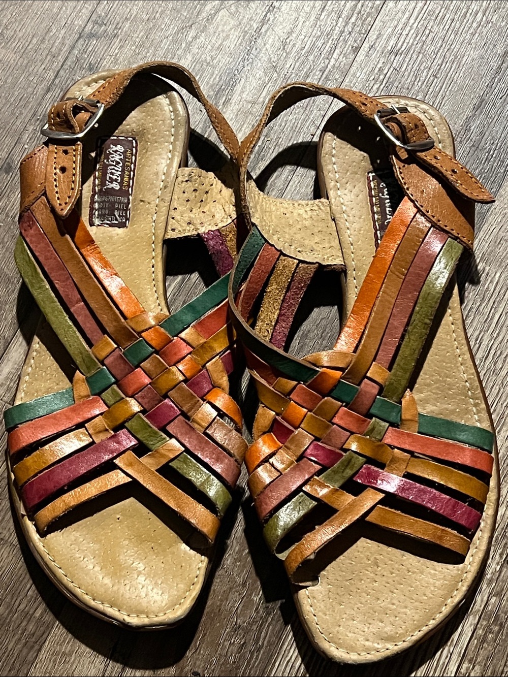 Boho or artisan-style huaraches with an open toe and flat sole.